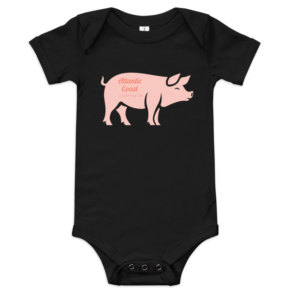 baby onesie with pink pig on the front, black