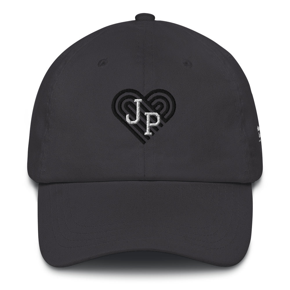 Jamaica Plain hat, with black heart behind "JP" letters in white. The hat is grey.