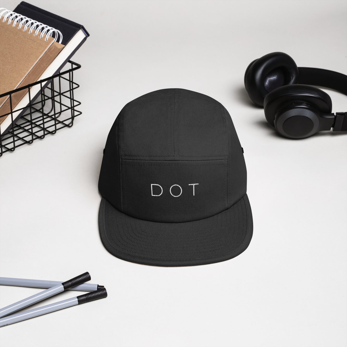 Dorchester "DOT" 5-panel Hat, with items in background, black