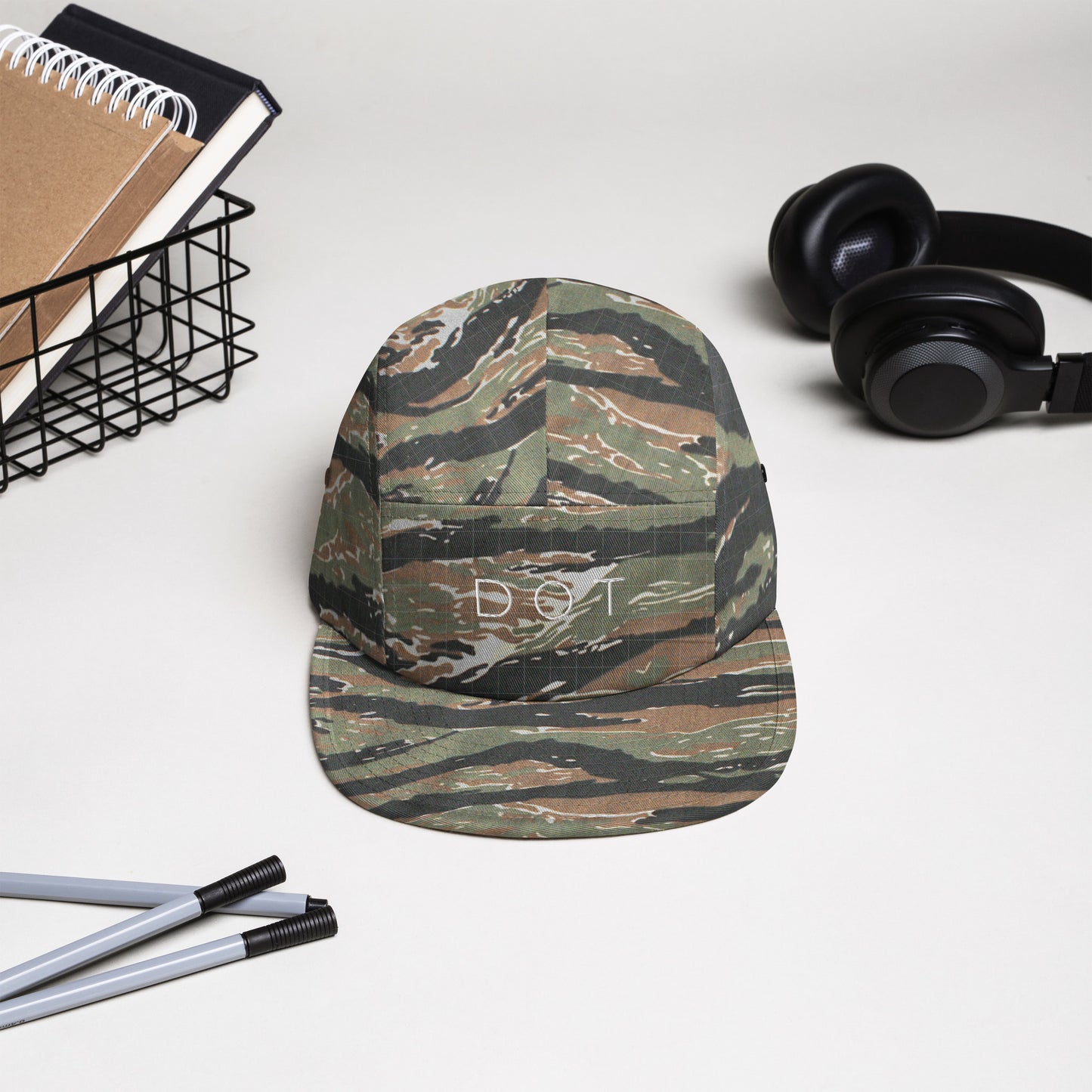 Dorchester "DOT" 5-panel Hat, with items in background, camo