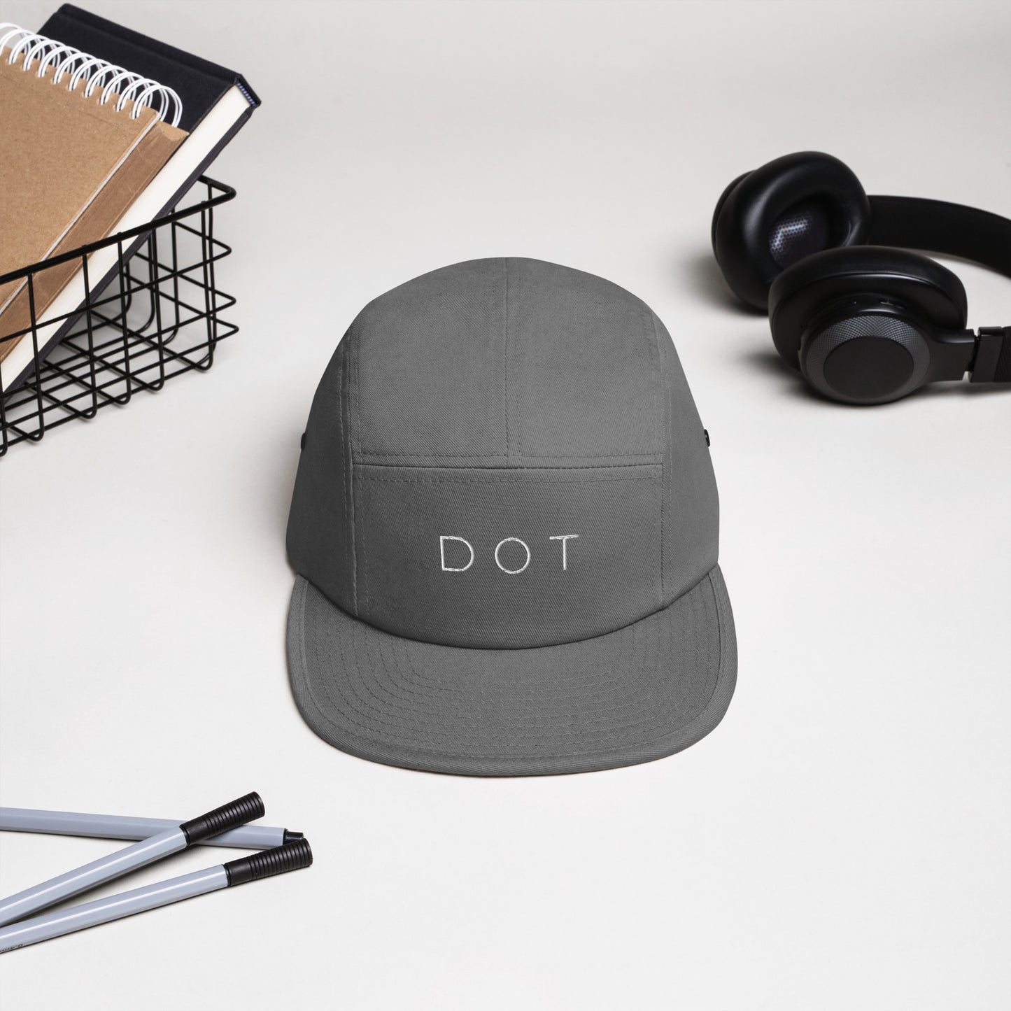 Dorchester "DOT" 5-panel Hat, with items in background, grey