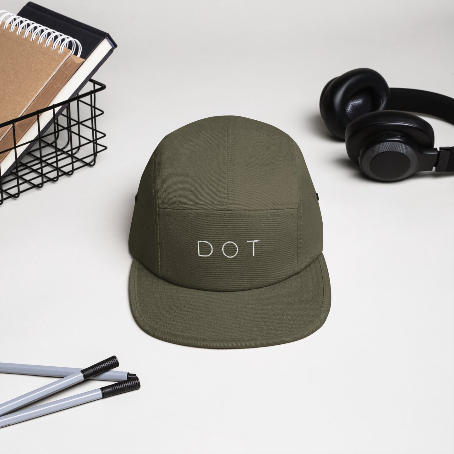 Dorchester "DOT" 5-panel Hat, with items in background, olive green