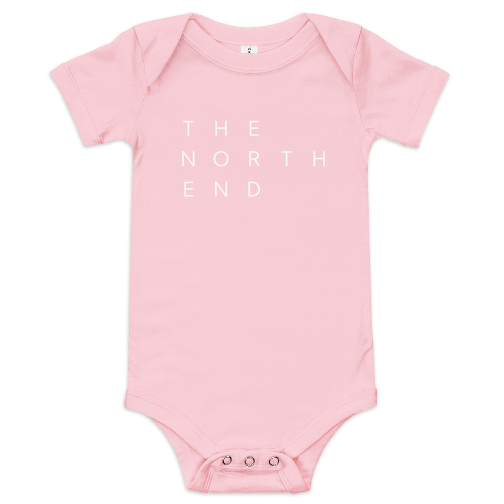 pink onesie with the text "The North End " in white.