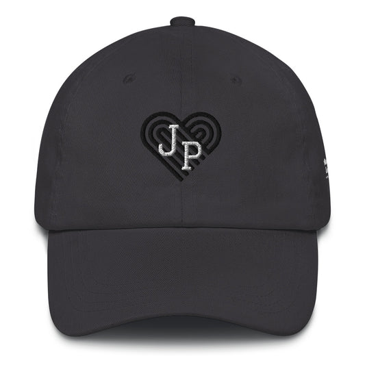 Jamaica Plain hat, with black heart behind "JP" letters in white. The hat is grey.