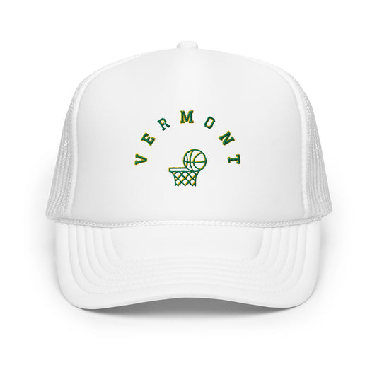 white hat with the text "vermont" in green. Image of basketball going into hoop