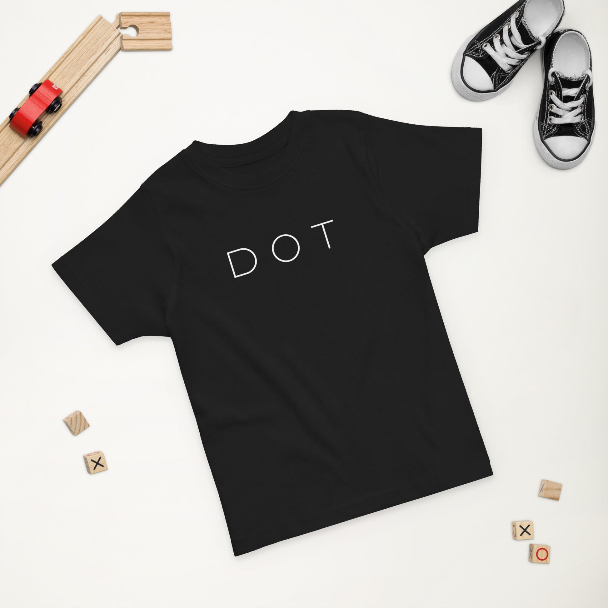 Dorchester "DOT" Tee (Toddler), toys in the background, black