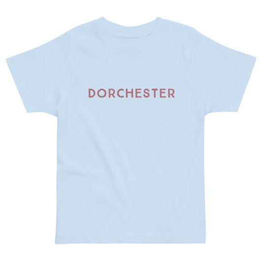 t-shirt with text across the front that reads "Dorchester". blue shirt 